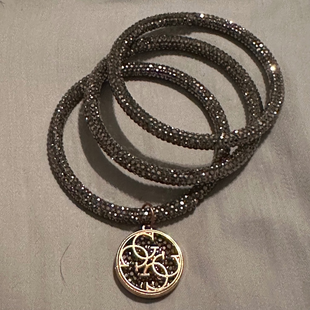 Set of three Guess crystal bangels.
